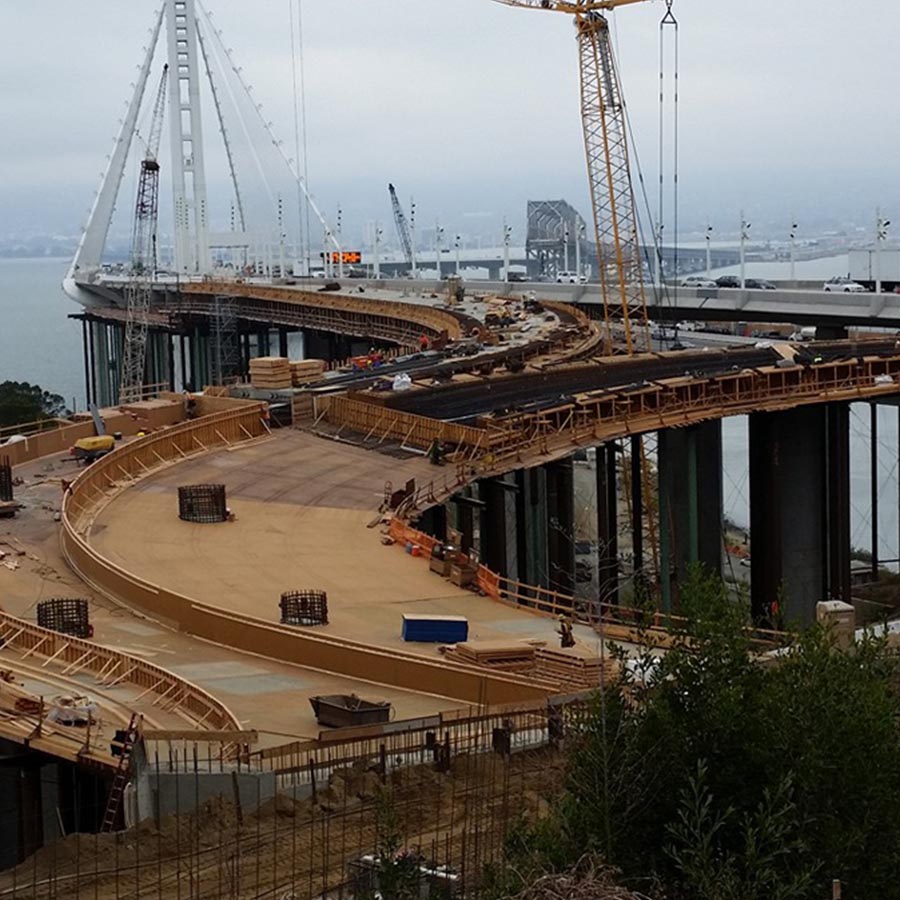 bridge under construction over a river or a lake